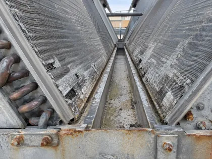 corroded lower rows of a V-bank coil