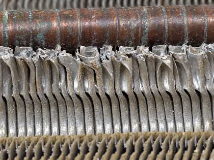 fin collars loosened around copper tubes