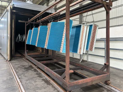 rack of cleaned coils entering the drying oven