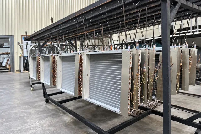 batch of coils racked on a hanging line
