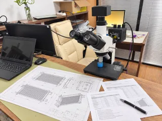 coil drawings and specification sheets on the review desk